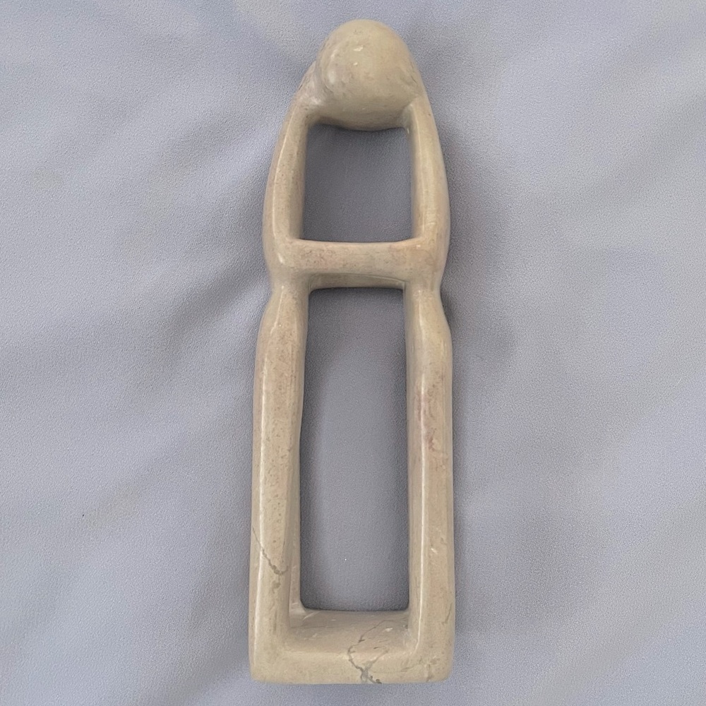 Beautiful smooth sculpture of two people embracing